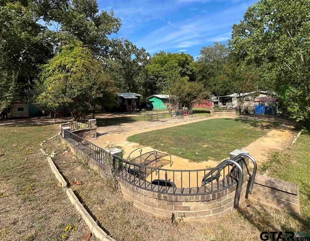 a view of swimming pool with sitting area
