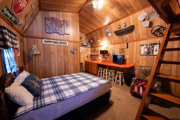 a bedroom with furniture and a book