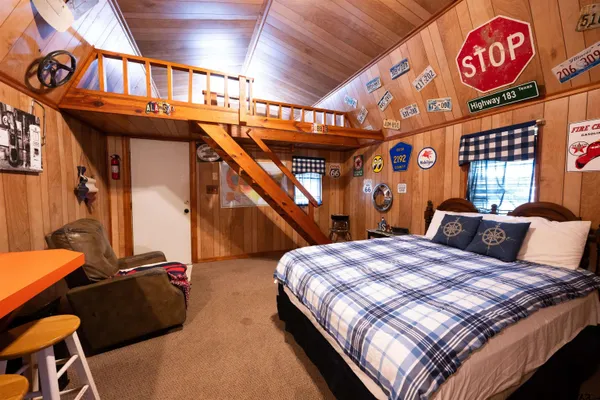 a bed room with a bed and a walk in closet