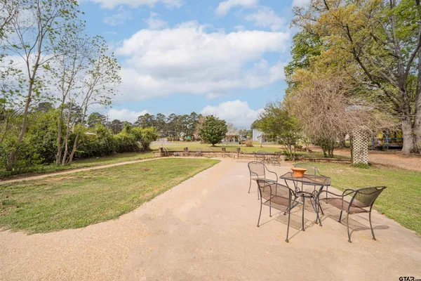 a view of a swimming pool with a lawn chairs