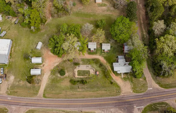 a view of a playground with basketball court
