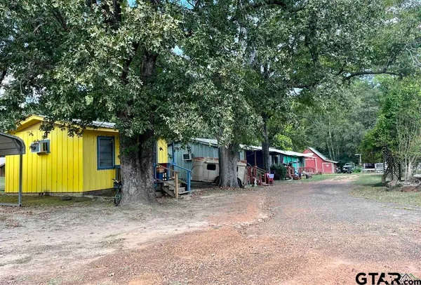 a view of a park with swings and slides