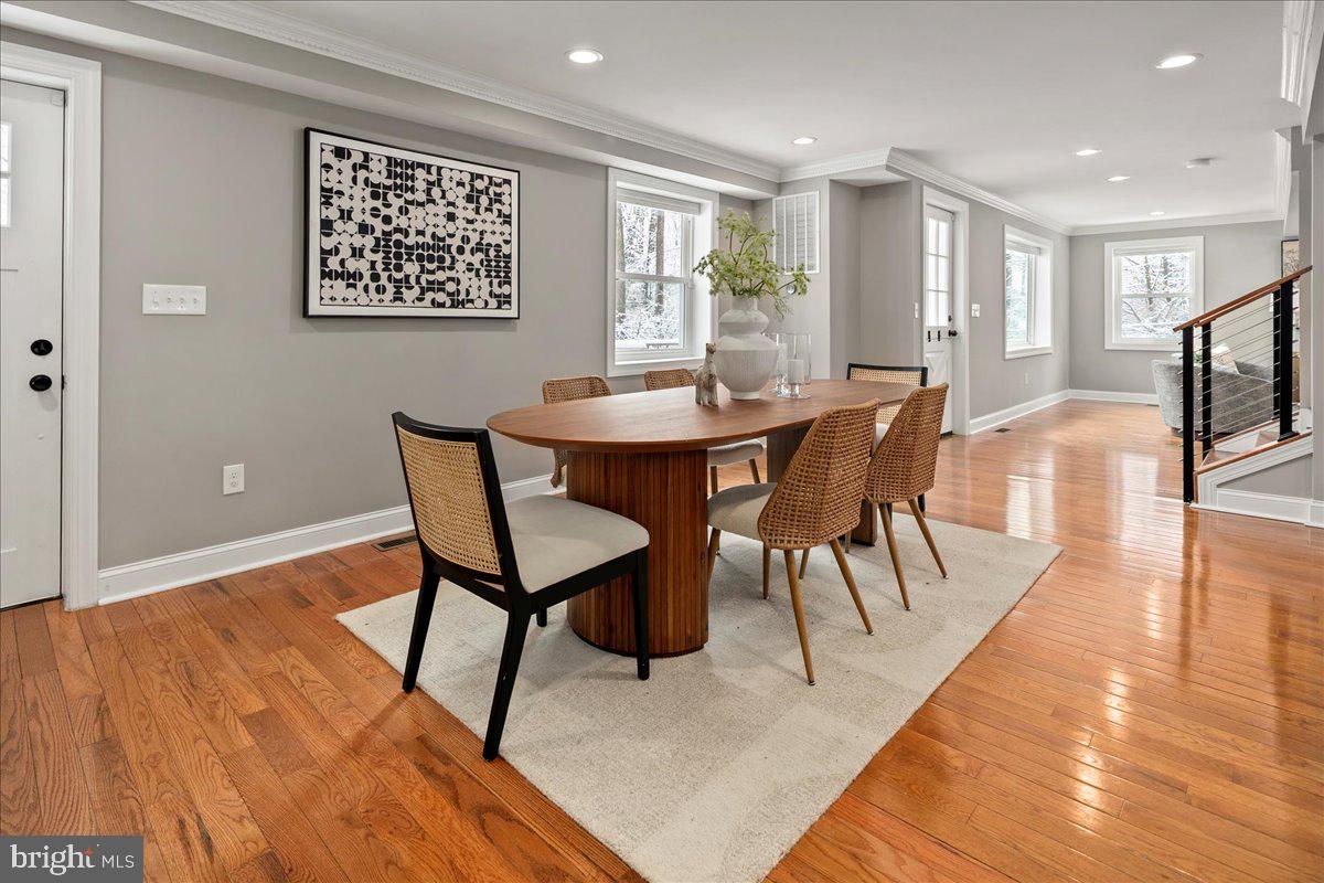 111 Sunnyside Road Silver Spring, MD 20910 - Photo 11 of 44 a view of a dining room with furniture a rug and wooden floor
