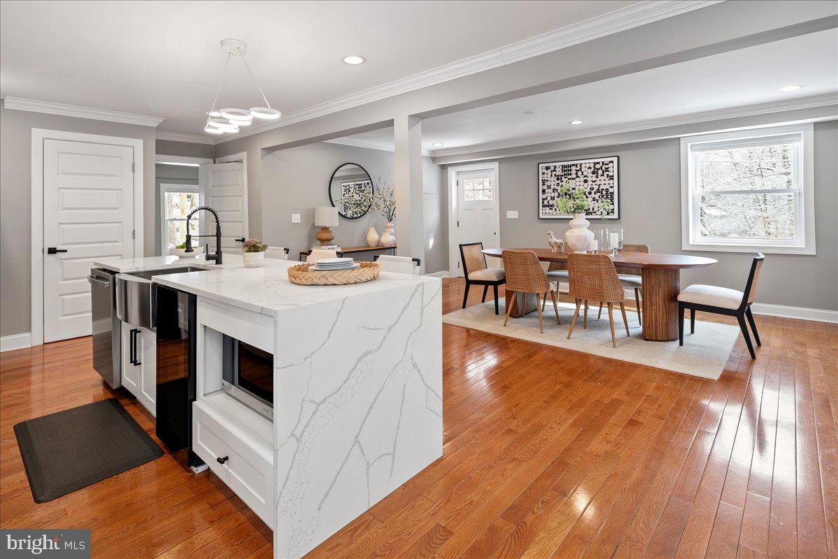 111 Sunnyside Road Silver Spring, MD 20910 - Photo 14 of 44 a view of kitchen with cabinets and wooden floor
