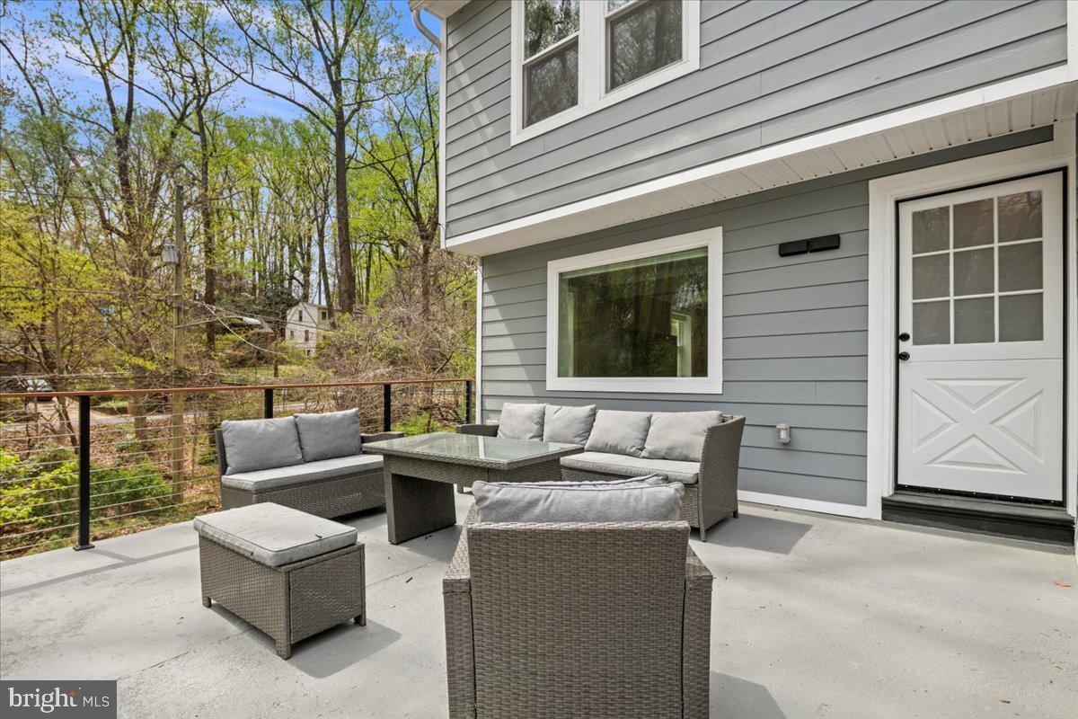 111 Sunnyside Road Silver Spring, MD 20910 - Photo 21 of 44 a view of a house with couches and a fire pit