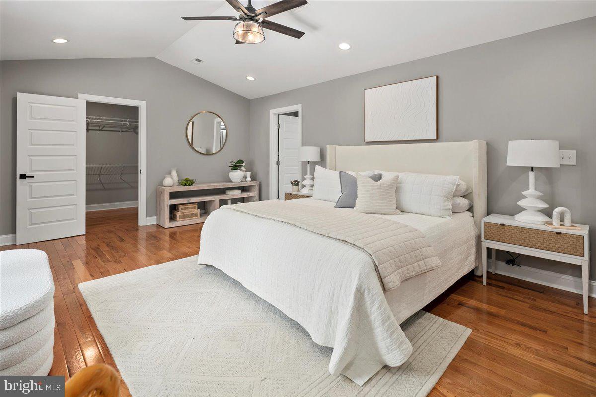 111 Sunnyside Road Silver Spring, MD 20910 - Photo 25 of 44 a bedroom with a bed a mirror and furniture