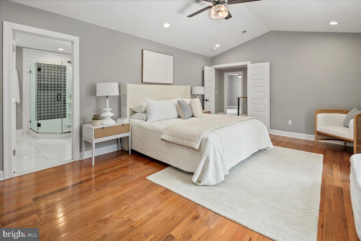 111 Sunnyside Road Silver Spring, MD 20910 - Photo 26 of 44 a bedroom with a bed chandelier and a window