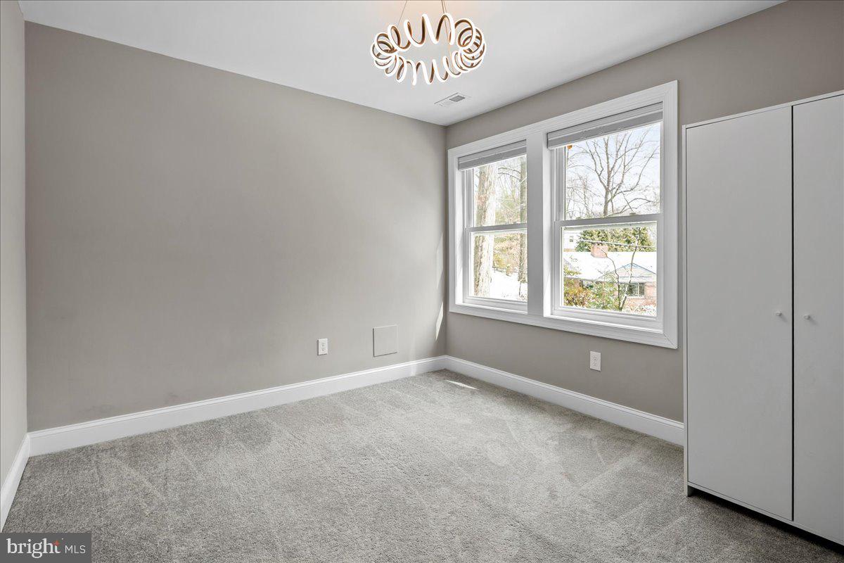 111 Sunnyside Road Silver Spring, MD 20910 - Photo 30 of 44 a view of an empty room with a window