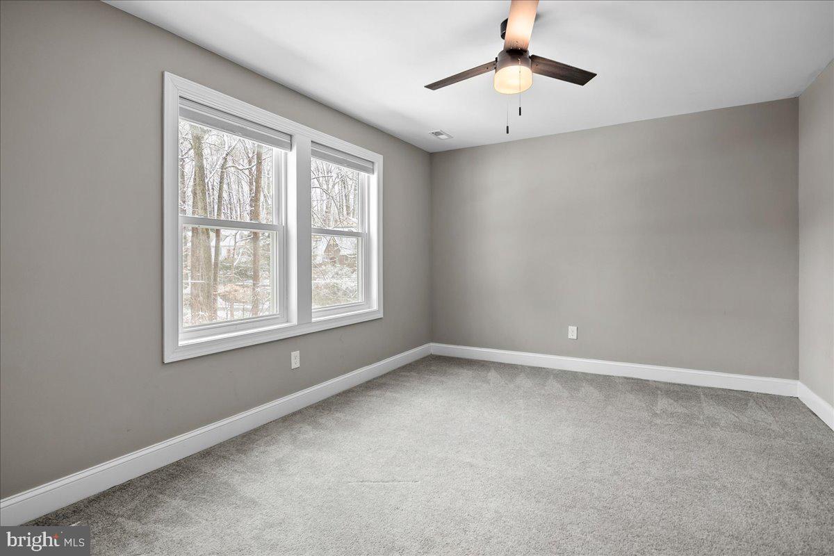 111 Sunnyside Road Silver Spring, MD 20910 - Photo 32 of 44 a view of an empty room with a window