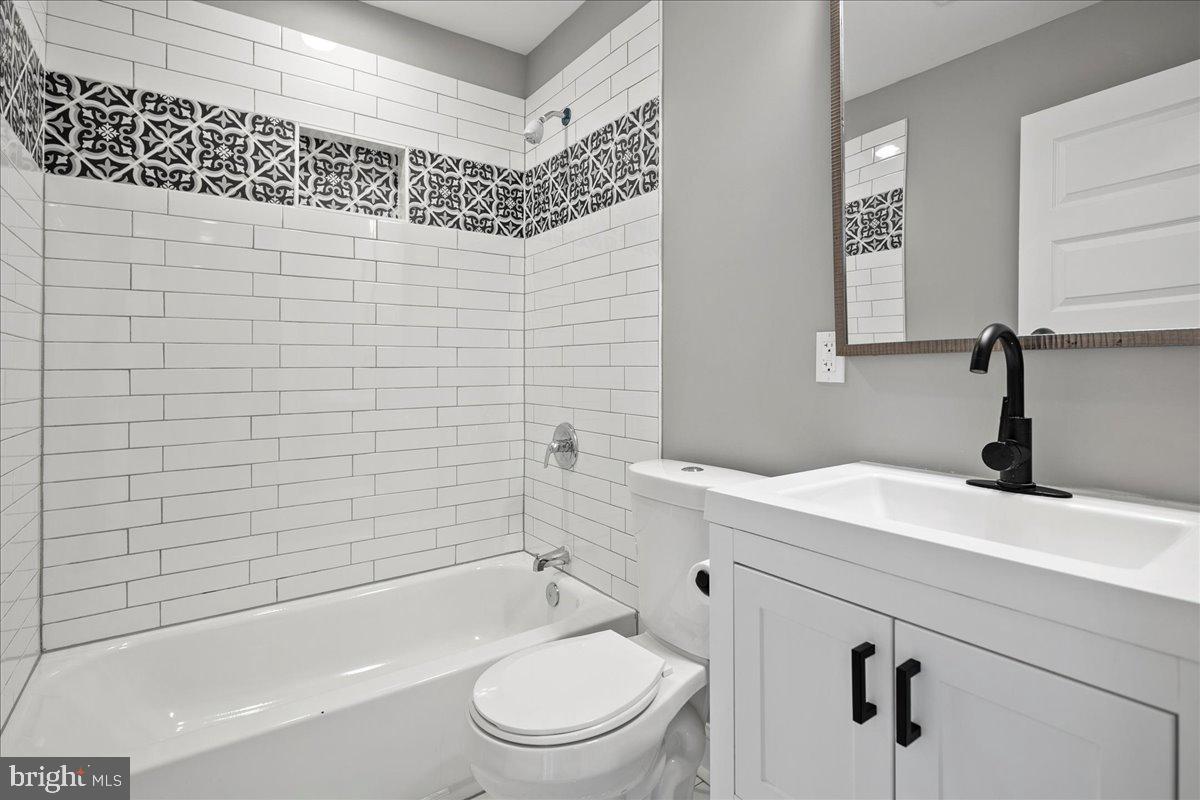 111 Sunnyside Road Silver Spring, MD 20910 - Photo 33 of 44 a bathroom with a sink a toilet and shower