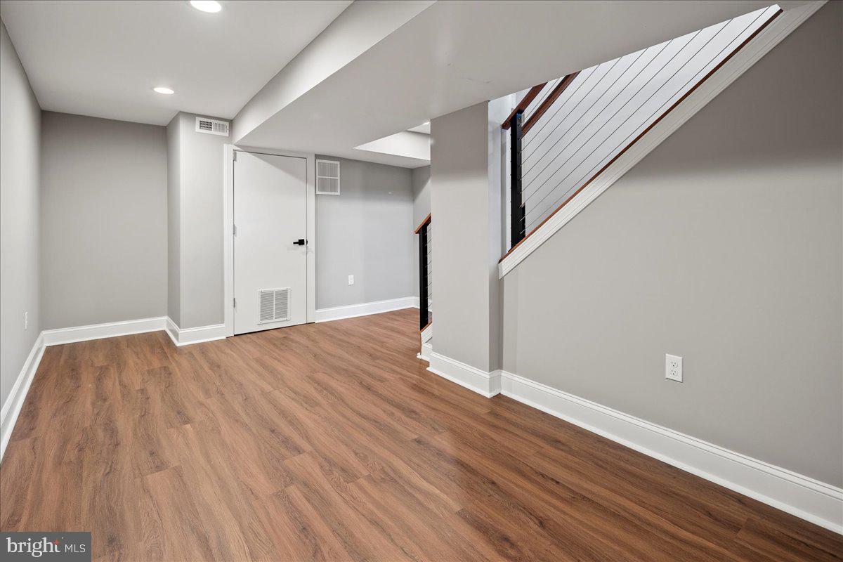111 Sunnyside Road Silver Spring, MD 20910 - Photo 37 of 44 a view of an empty room with wooden floor