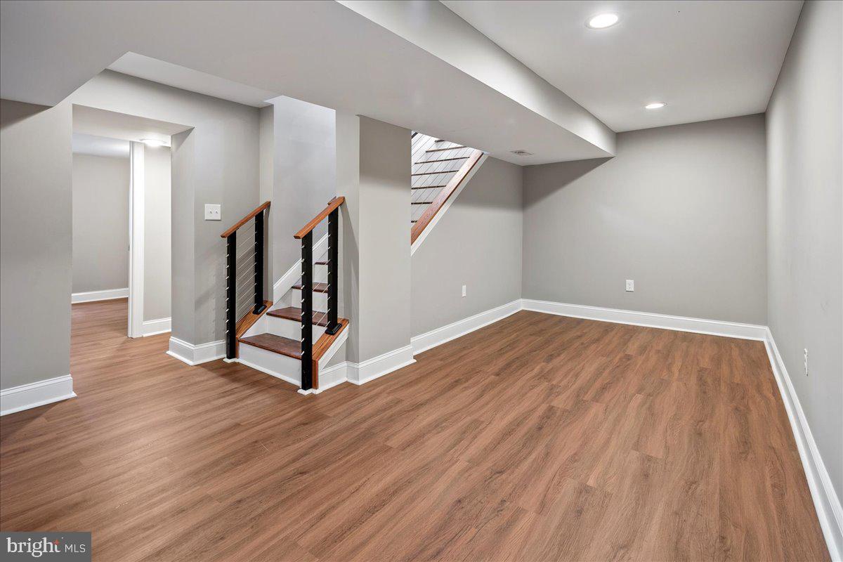 111 Sunnyside Road Silver Spring, MD 20910 - Photo 38 of 44 wooden floor in an empty room with a fireplace