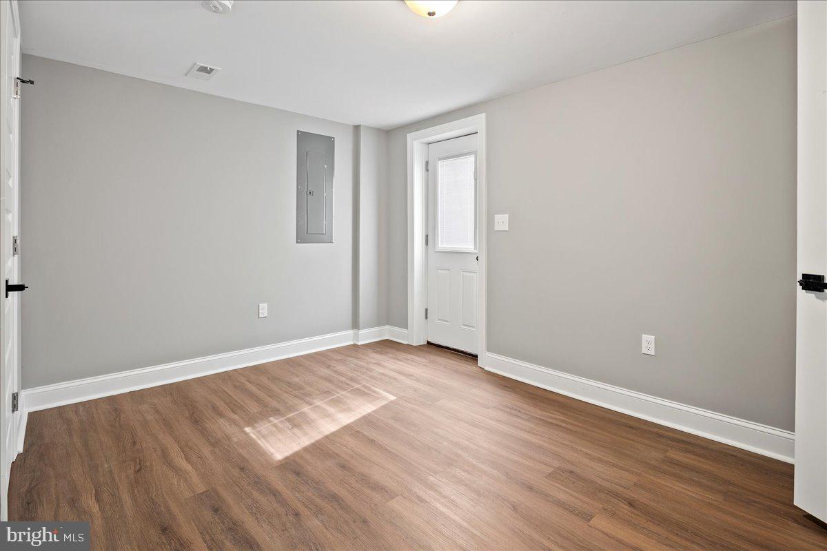 111 Sunnyside Road Silver Spring, MD 20910 - Photo 41 of 44 a view of an empty room with wooden floor