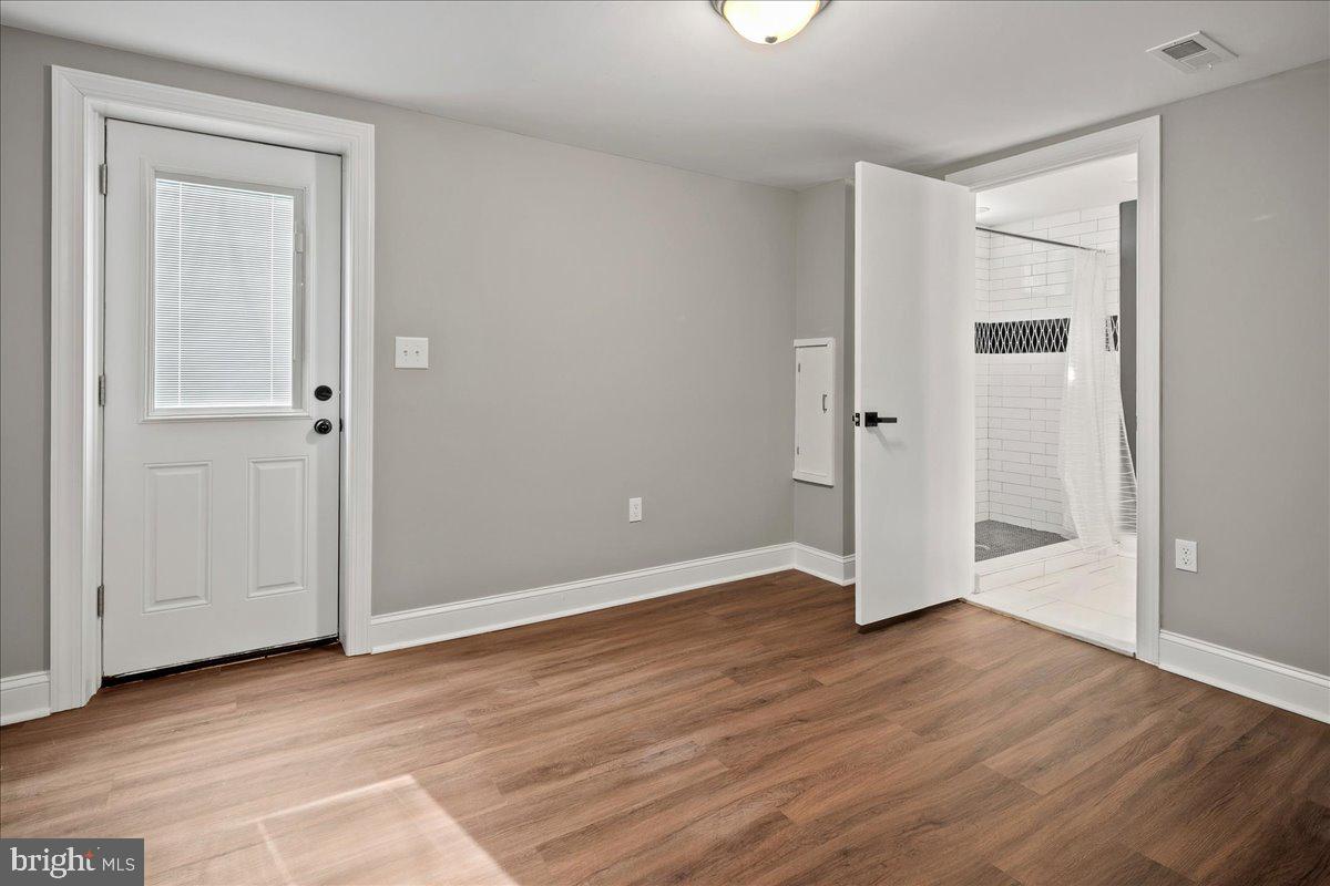 111 Sunnyside Road Silver Spring, MD 20910 - Photo 42 of 44 an empty room with wooden floor & closet area