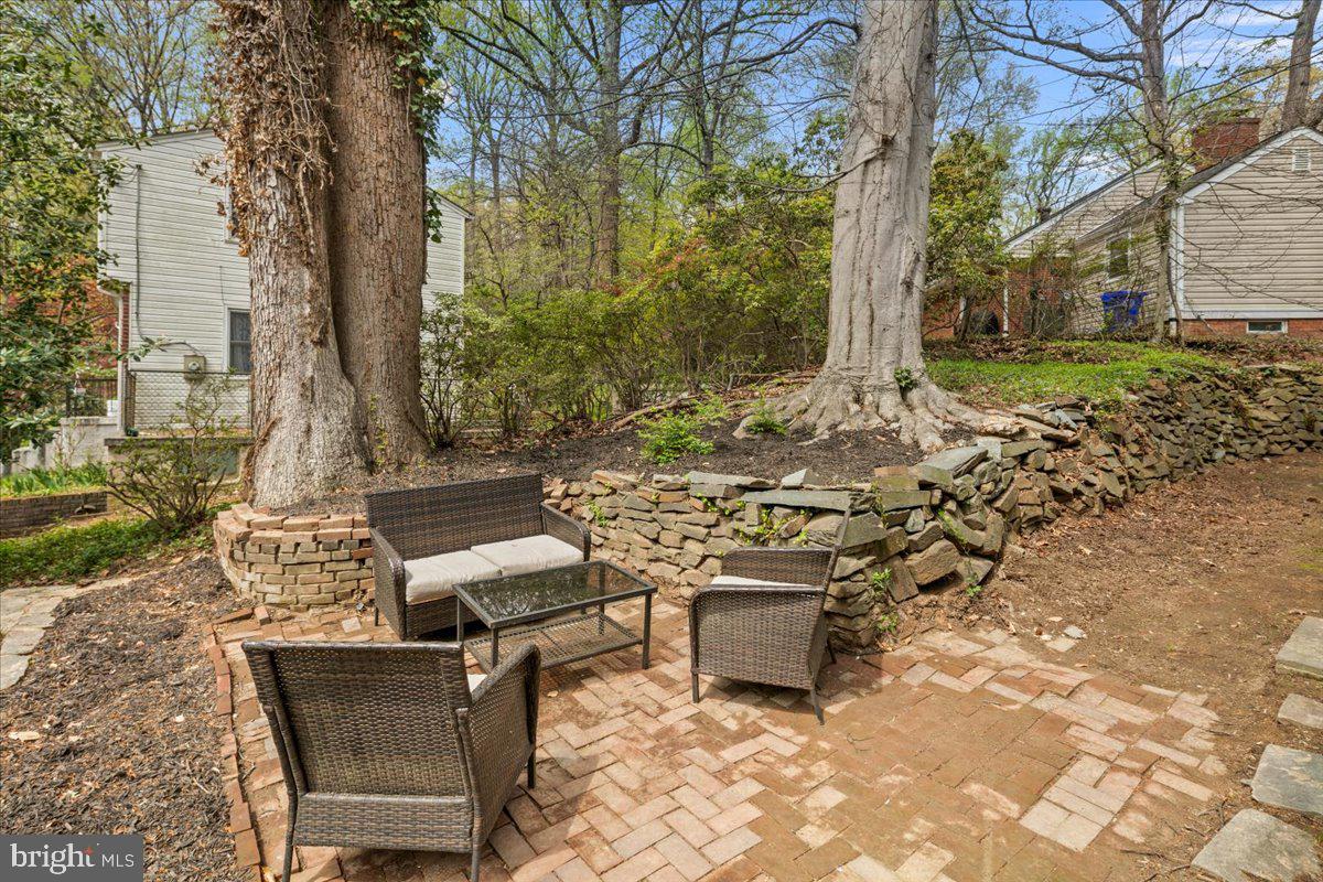111 Sunnyside Road Silver Spring, MD 20910 - Photo 44 of 44 a view of a patio with table and chairs and potted plants