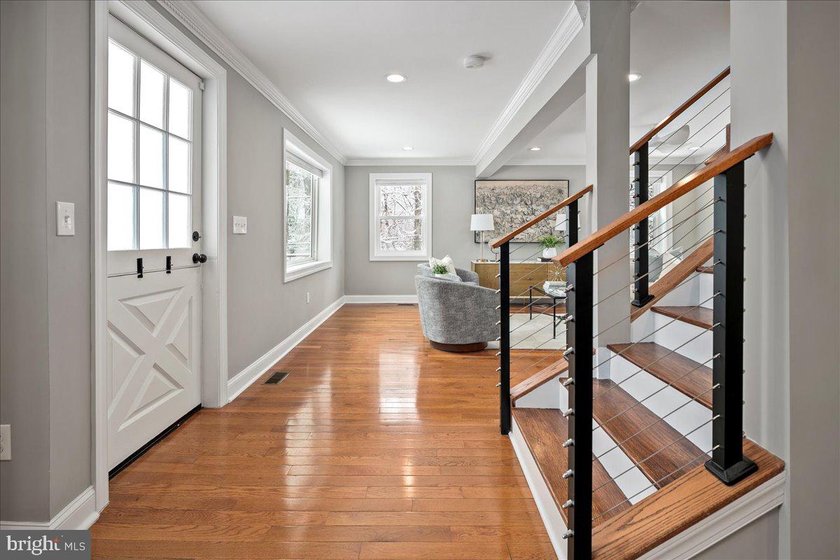 111 Sunnyside Road Silver Spring, MD 20910 - Photo 8 of 44 a view of an entryway with wooden floor and door