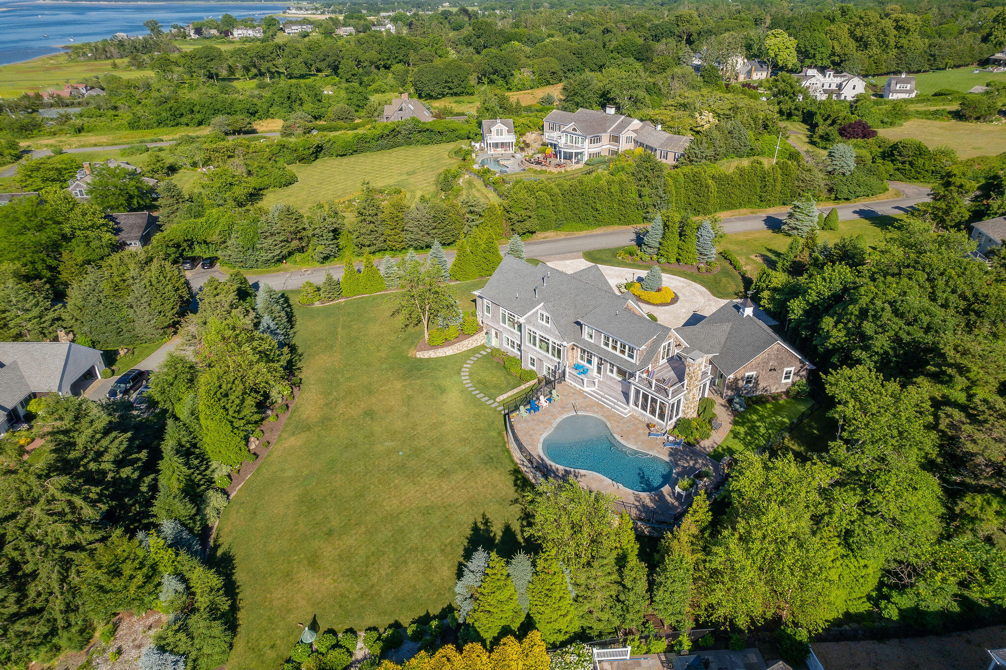 111 Harris Meadow Lane Barnstable, MA 02630 - Photo 53 of 56 an aerial view of residential house with outdoor space and swimming pool