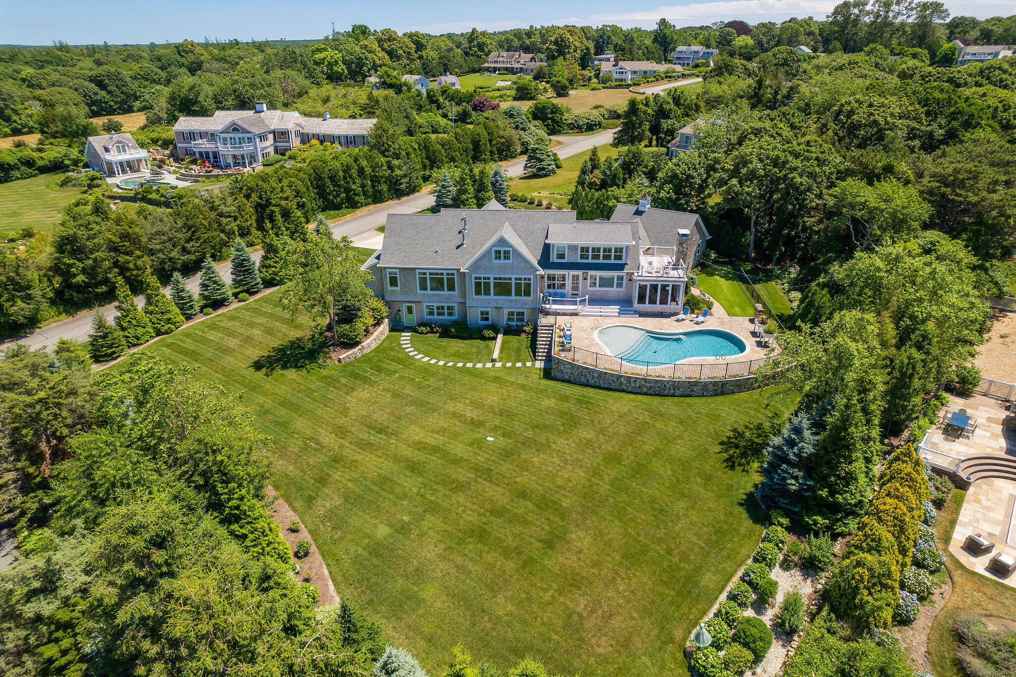 111 Harris Meadow Lane Barnstable, MA 02630 - Photo 55 of 56 an aerial view of a house with swimming pool and green space