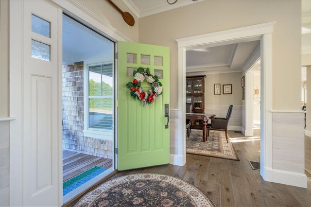 a living room filled with furniture and a window