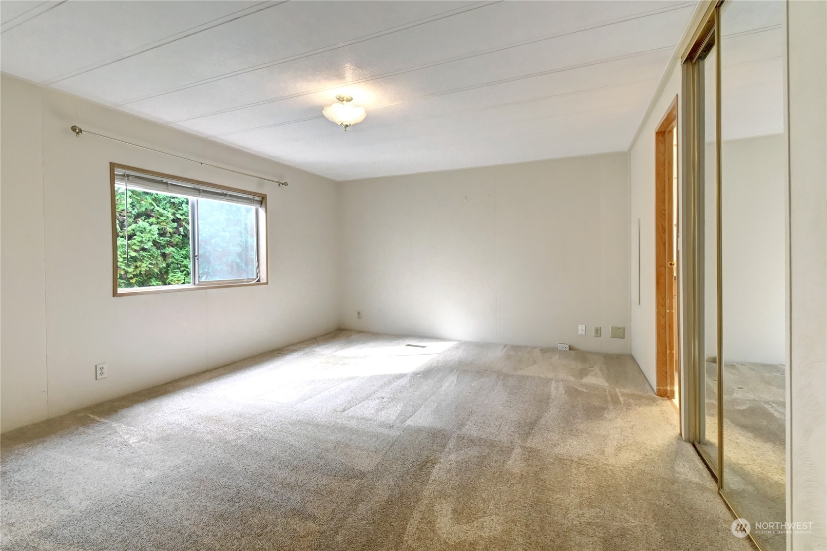 23827 7th Place West Bothell, WA 98021 - Photo 14 of 36 a view of an empty room with a window