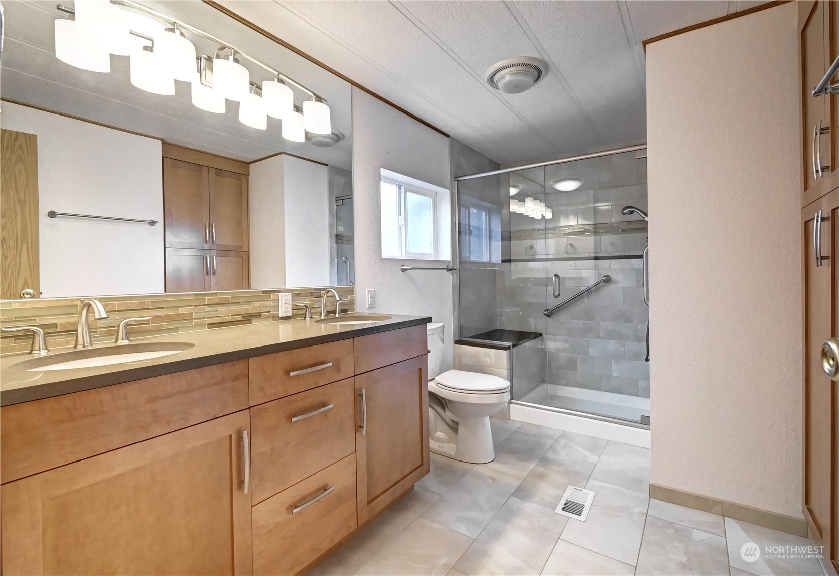 23827 7th Place West Bothell, WA 98021 - Photo 16 of 36 a bathroom with a sink a toilet and a mirror