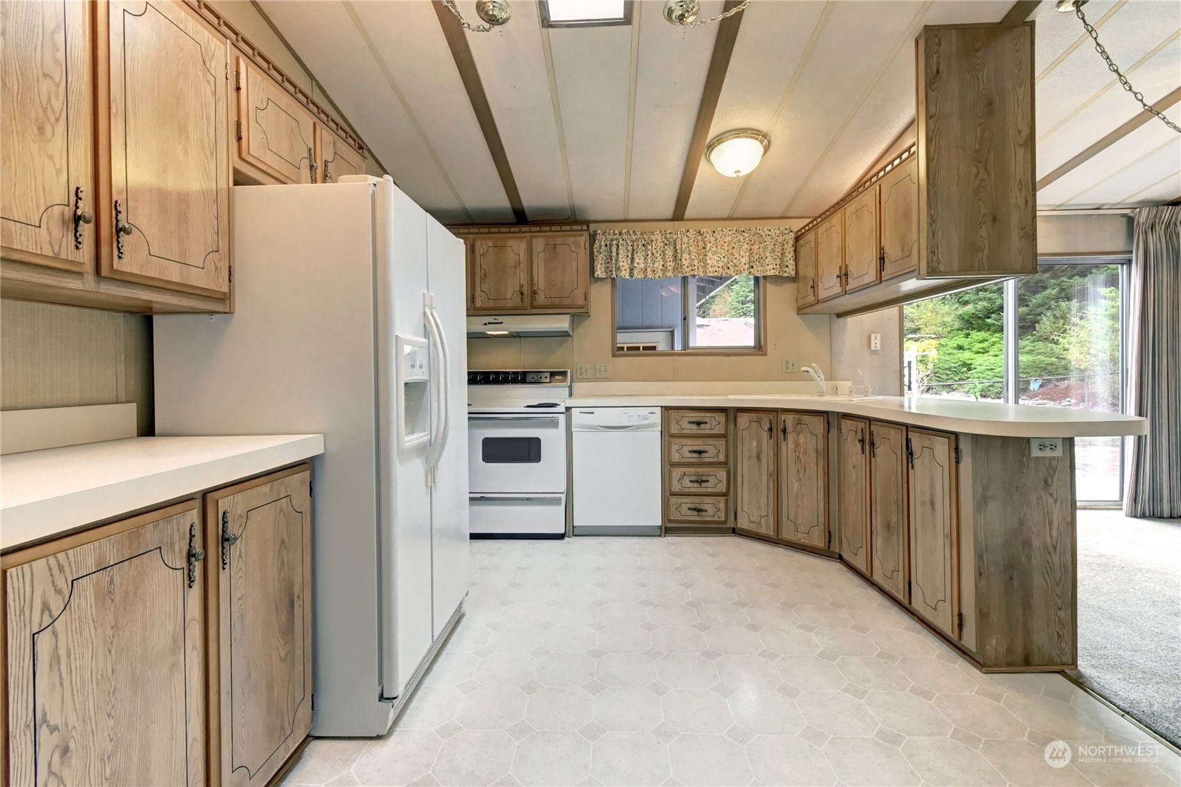 23827 7th Place West Bothell, WA 98021 - Photo 7 of 36 a kitchen with stainless steel appliances a refrigerator and a stove
