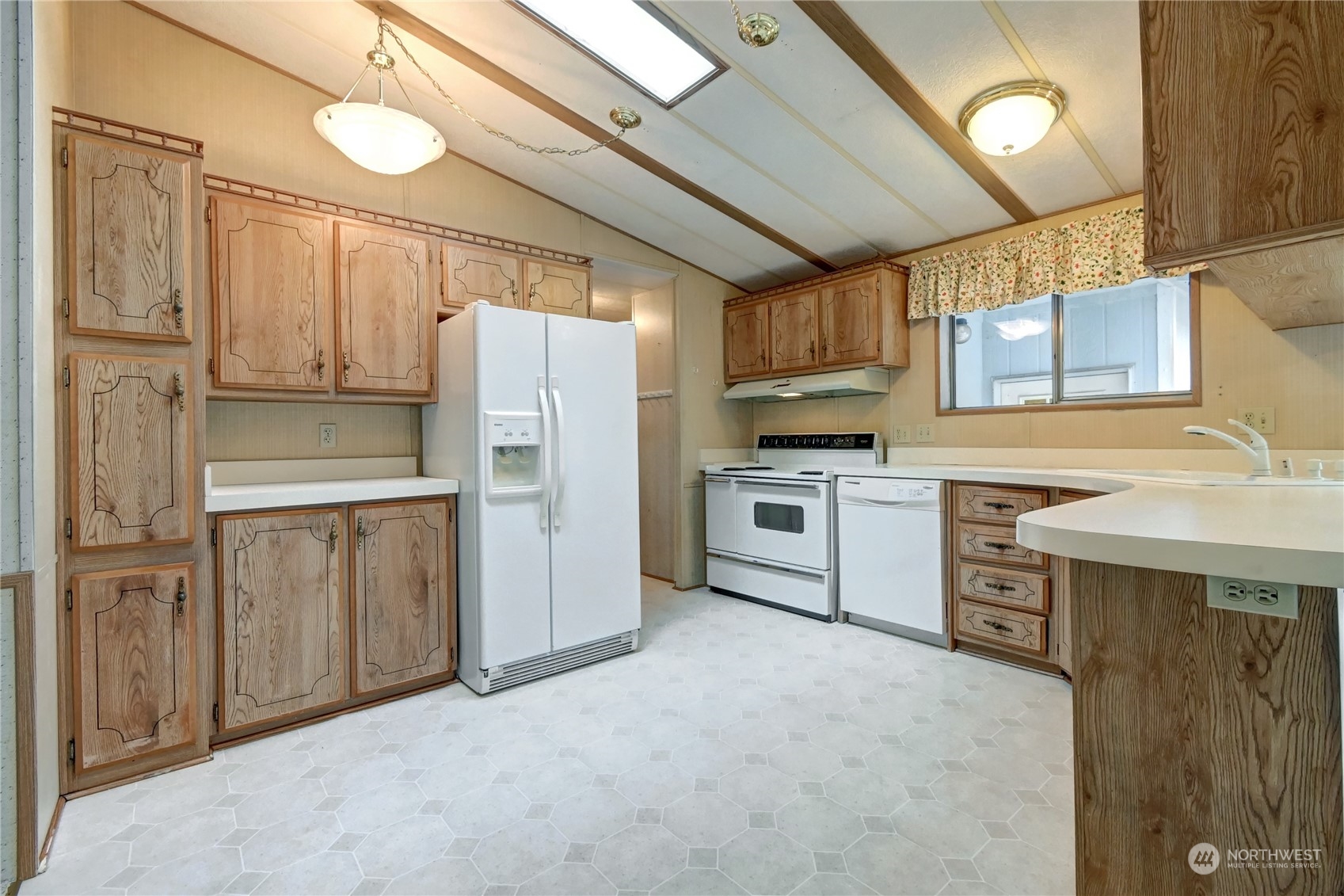 23827 7th Place West Bothell, WA 98021 - Photo 8 of 36 a kitchen with cabinets and stainless steel appliances