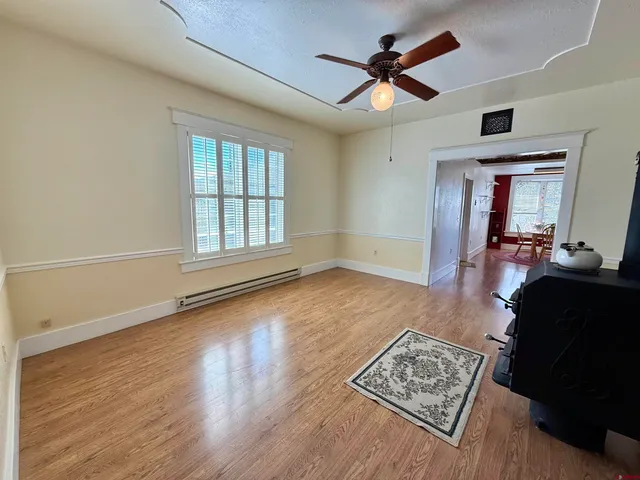 a view of a dining room with furniture window and wooden floor