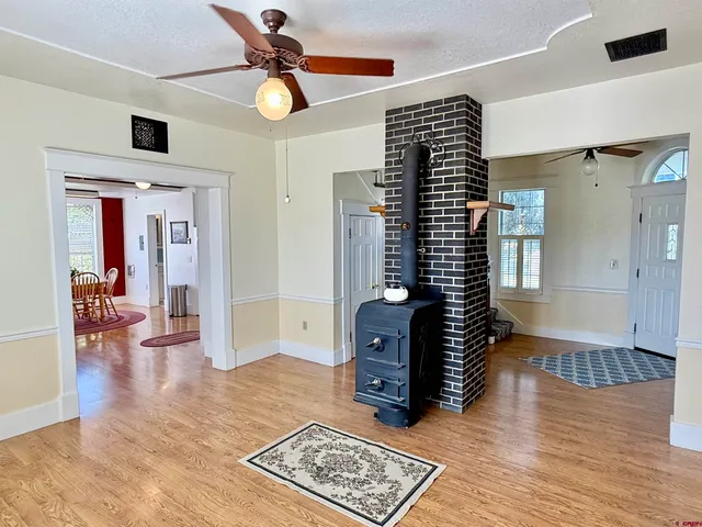a kitchen with a refrigerator and a stove top oven