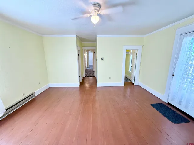 a bathroom with a sink a toilet a mirror and shower