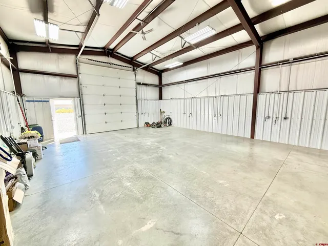 a patio with table and chairs