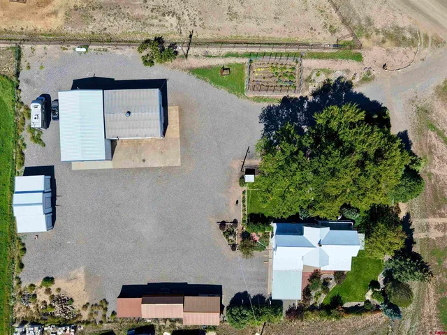an aerial view of a house with a lake view
