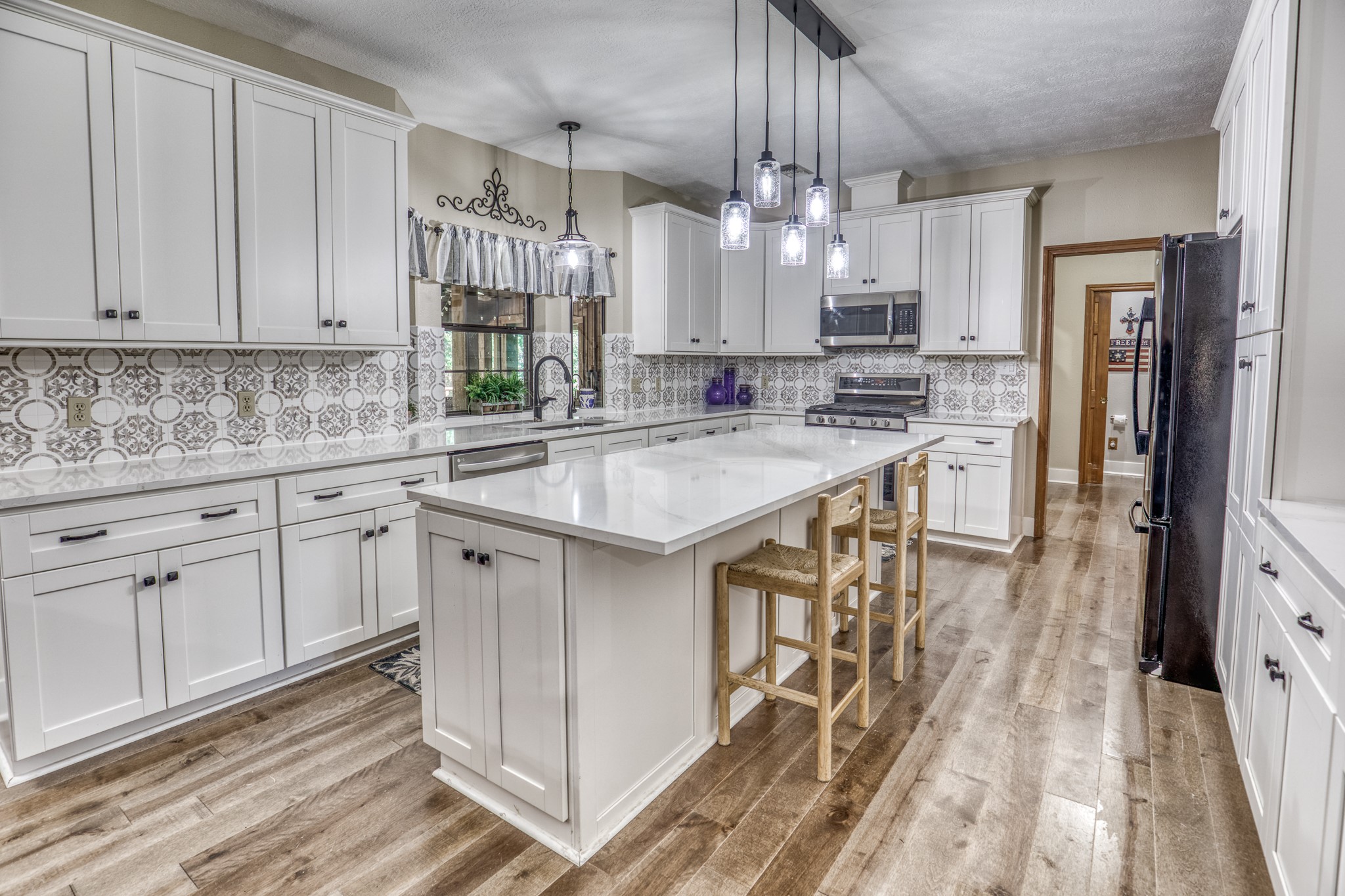1017 Allen Road Cat Spring, TX 78933 - Photo 13 of 47 a kitchen with white cabinets appliances and sink