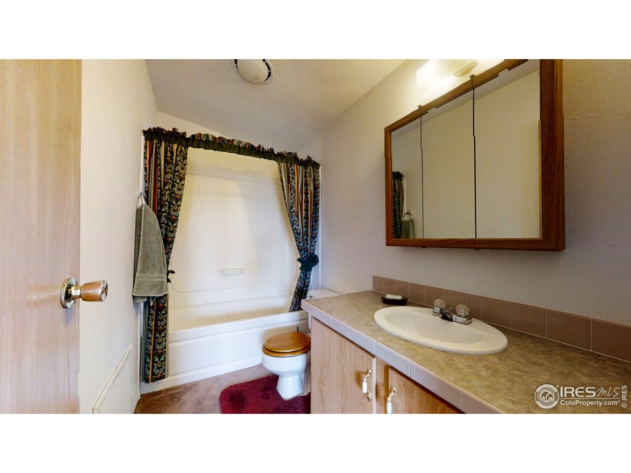 4520 Davis Ranch Road Bellvue, CO 80512 - Photo 12 of 14 a bathroom with a sink and a mirror