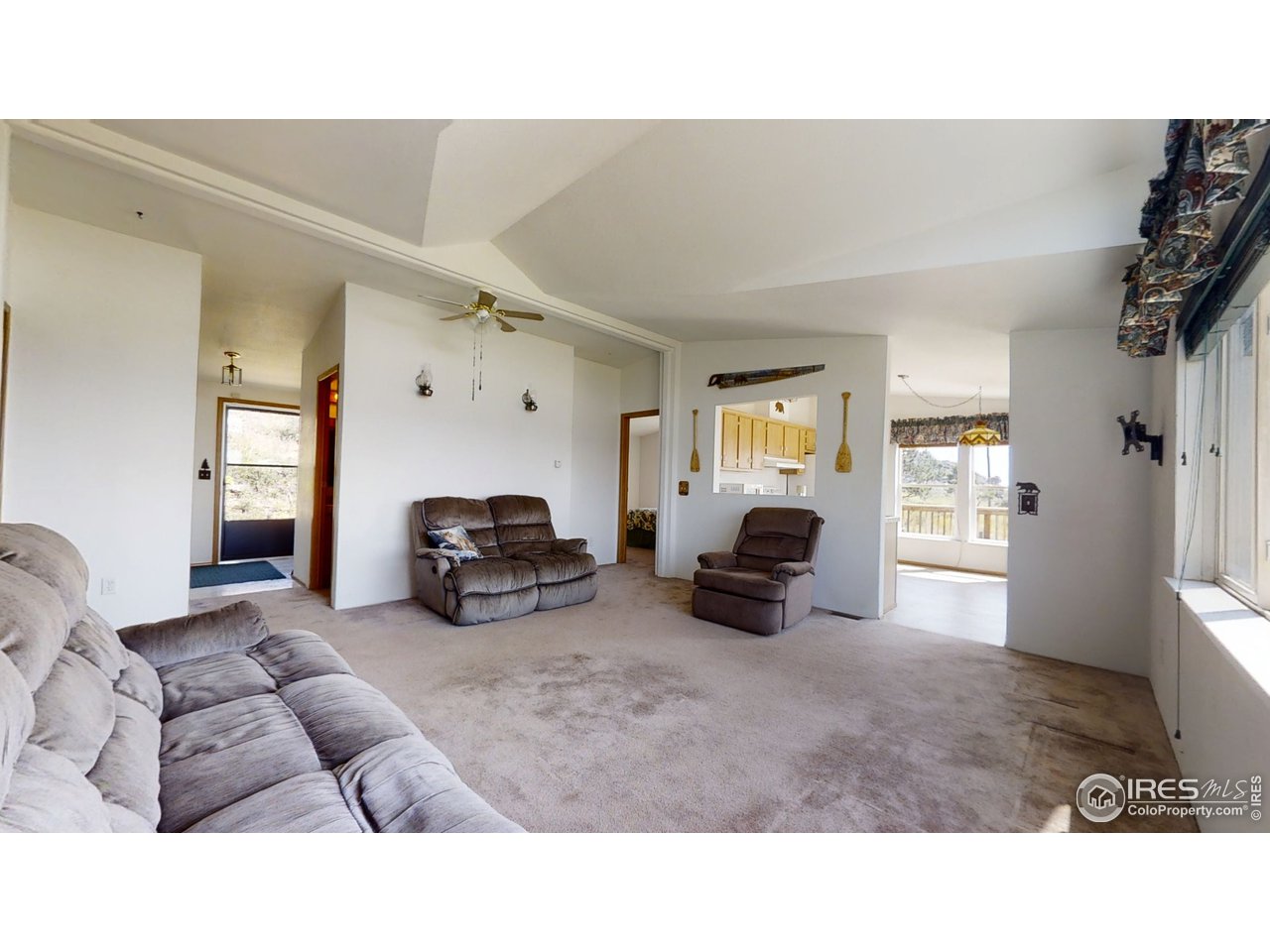 4520 Davis Ranch Road Bellvue, CO 80512 - Photo 5 of 14 a living room with furniture and a fireplace
