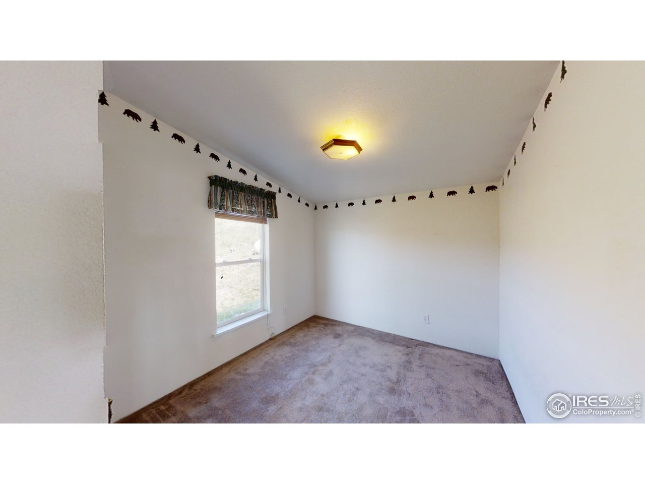 4520 Davis Ranch Road Bellvue, CO 80512 - Photo 7 of 14 a open kitchen with window and furniture