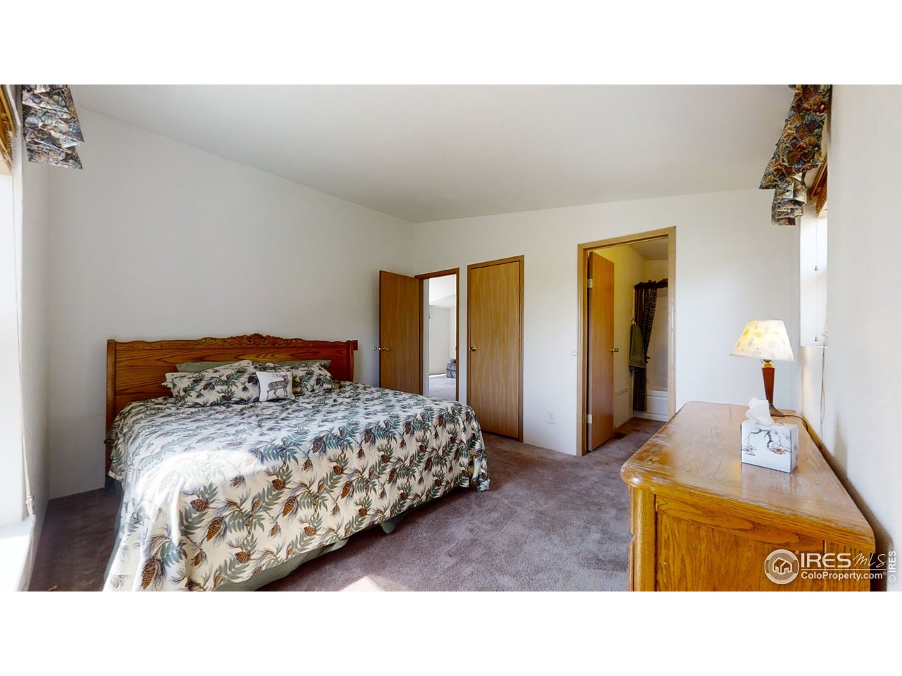 4520 Davis Ranch Road Bellvue, CO 80512 - Photo 9 of 14 a bedroom with a bed and window