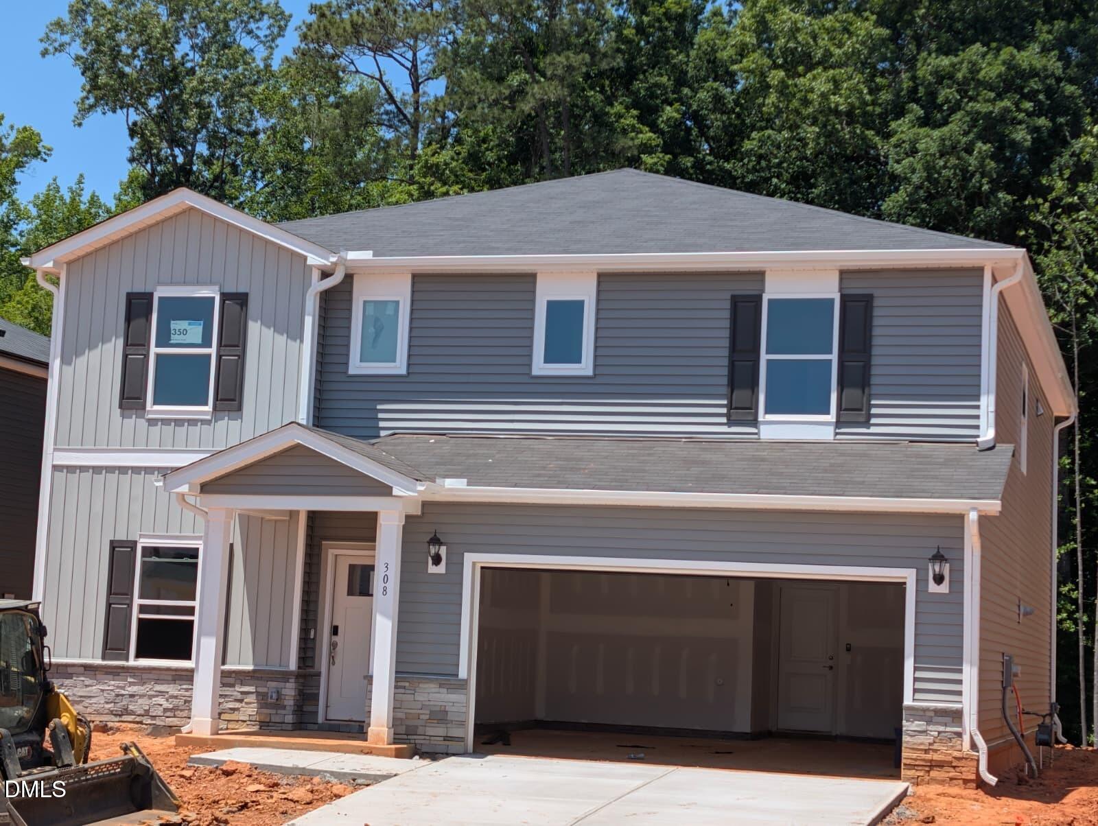 308 Karlov Road Garner, NC 27529 - Photo 48 of 55 a front view of a house with a yard