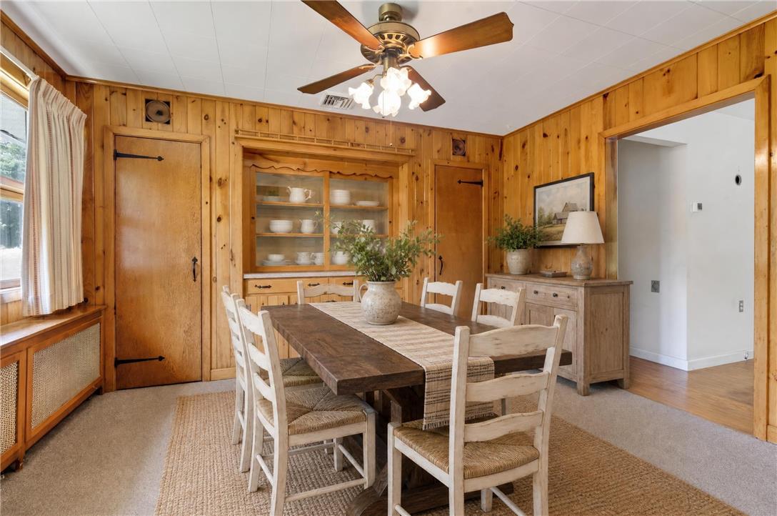51 Reynolds Road Tamaqua, PA 18252 - Photo 17 of 71 This cozy dining area features warm wood paneling and a built-in hutch for ample storage.