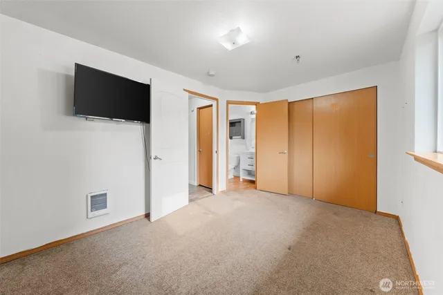 a view of empty room with flat screen tv