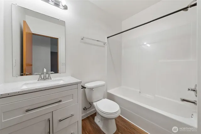 a bathroom with a sink a toilet and a bathtub