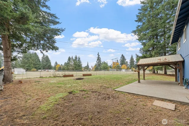 a view of outdoor space with garden and trees