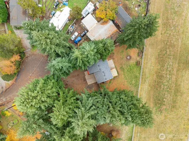 an aerial view of a house with a yard and garden