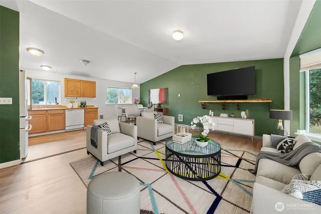 a living room with fireplace furniture and a flat screen tv