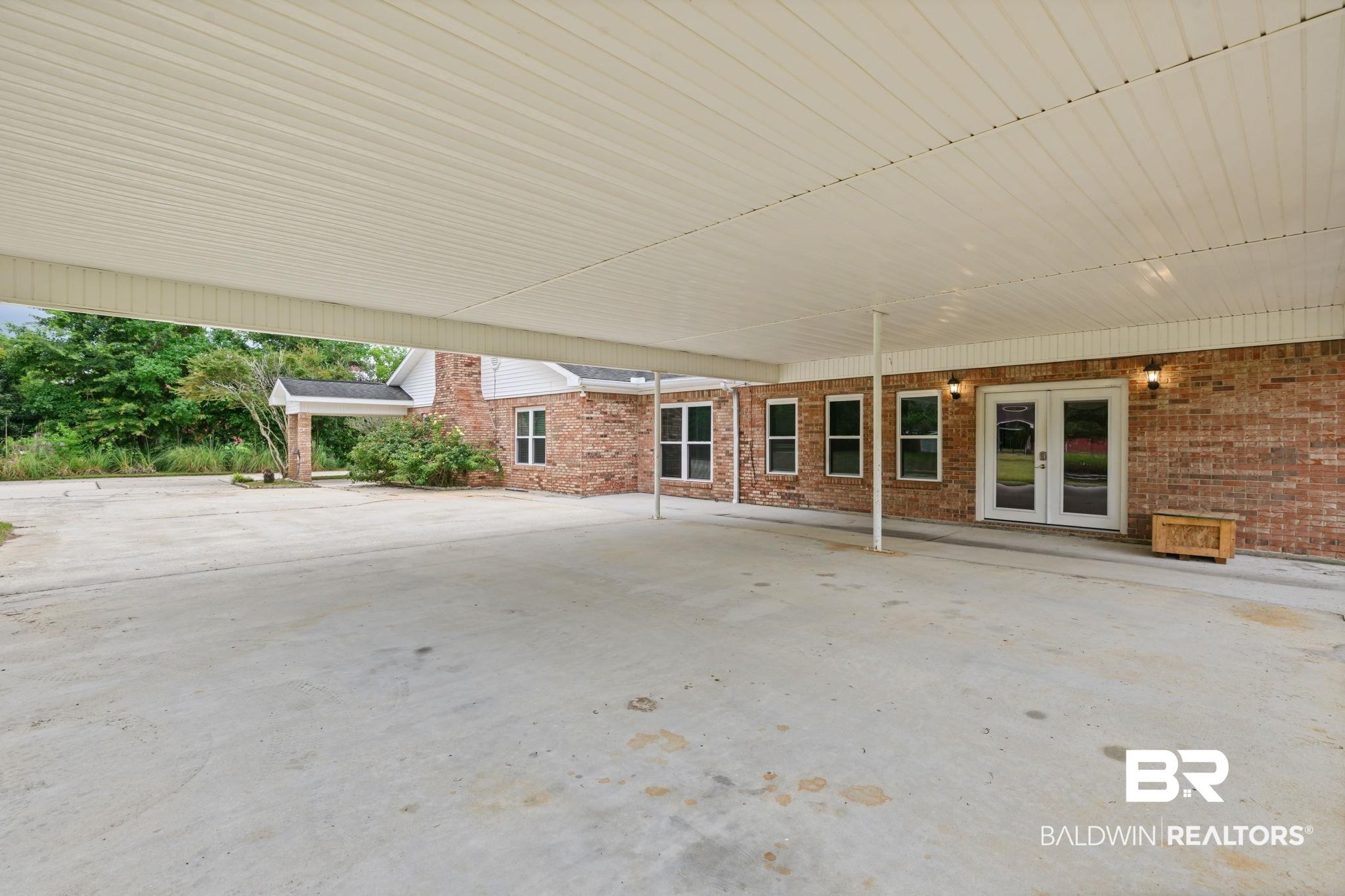 7540 2 Mile Road Irvington, AL 36544 - Photo 59 of 82 Expansive covered concrete patio with brick exterior