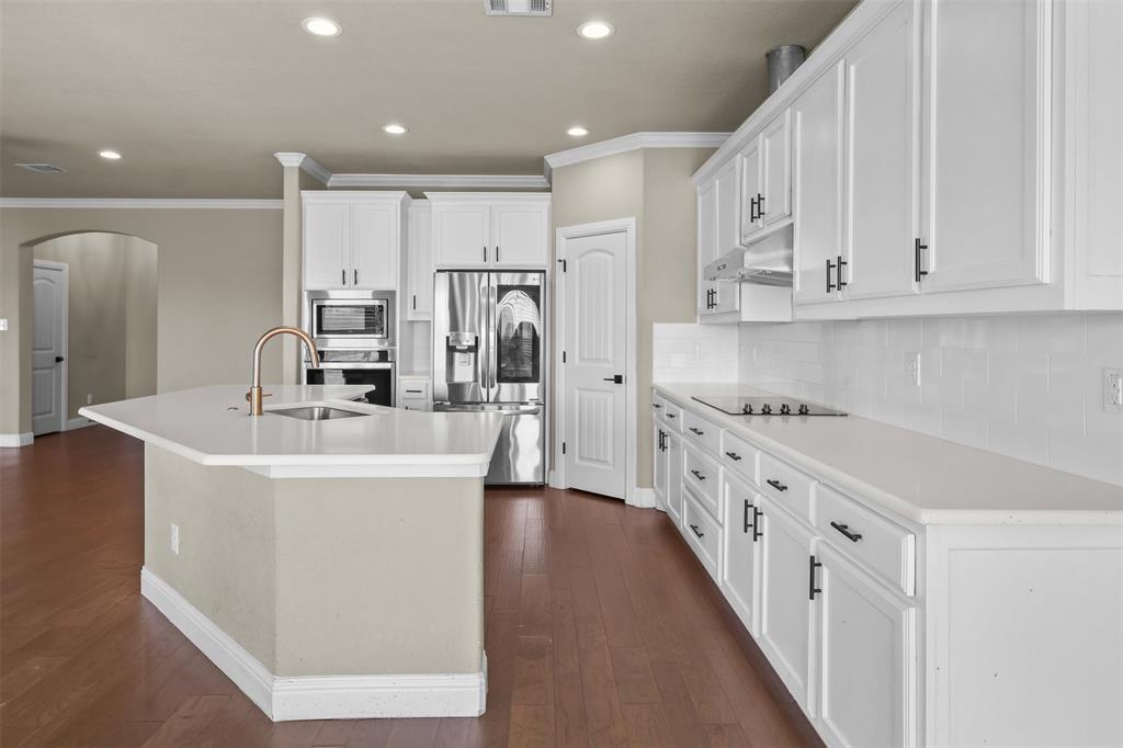 2451 Neck Road Palmer, TX 75152 - Photo 14 of 32 a kitchen with cabinets and a refrigerator