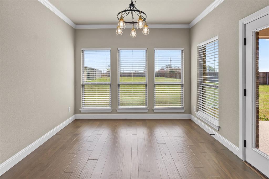 2451 Neck Road Palmer, TX 75152 - Photo 15 of 32 a view of wooden floor and windows in a room