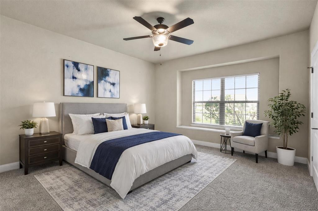 2451 Neck Road Palmer, TX 75152 - Photo 27 of 32 a spacious bedroom that has a bed and a couch