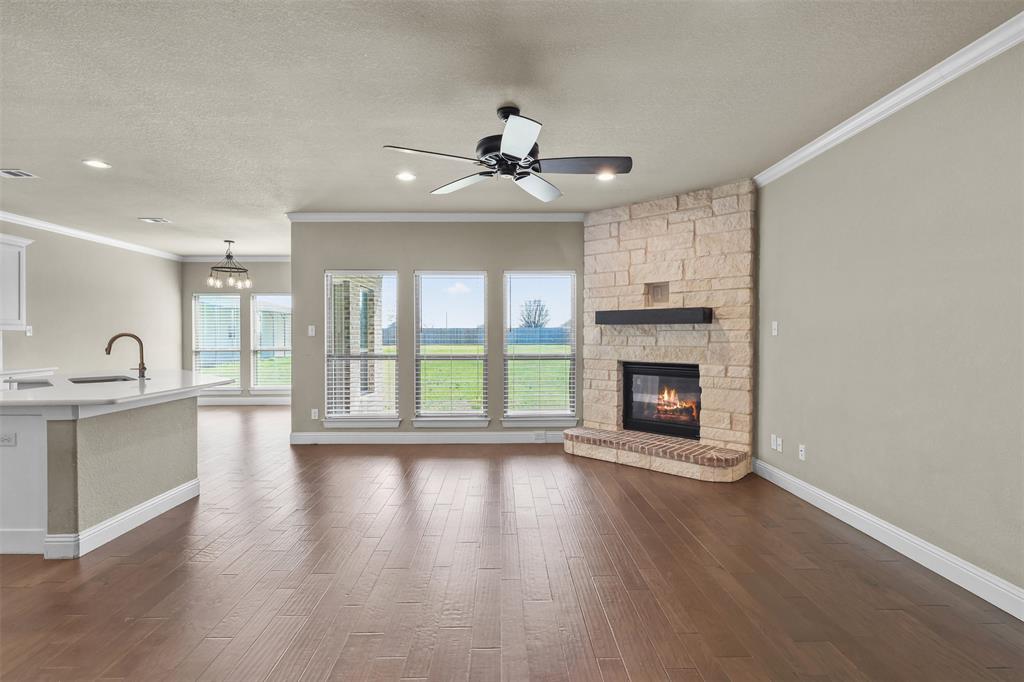 2451 Neck Road Palmer, TX 75152 - Photo 6 of 32 a view of an empty room with a fireplace and a window