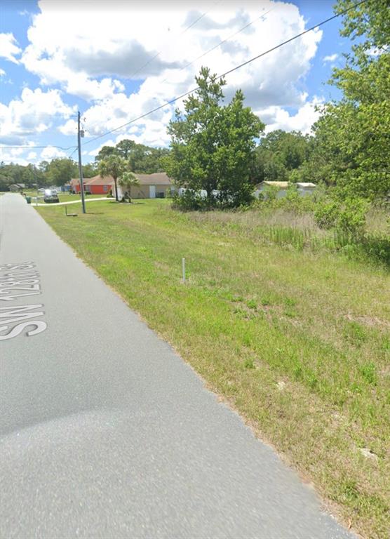 128 Southwest Sw Street Ocala, FL 34473 - Photo 3 of 3 a view of a lake with a big yard